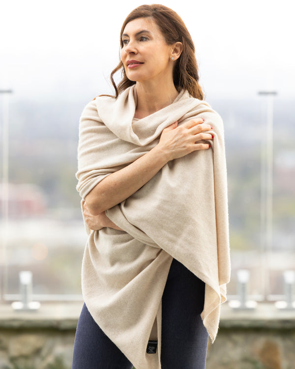 Woman wearing Voyage Cashmere Travel Wrap in oatmeal 