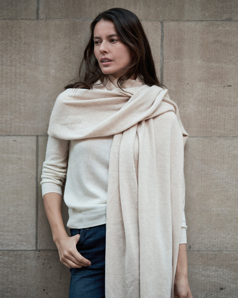 Woman wearing Voyage Cashmere Travel Wrap in oatmeal 