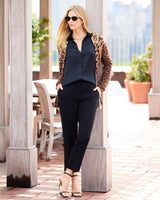model dressed in black wearing Savanna Open Animal Print Cardigan in camel multi