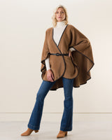 Woman Wearing Alpaca Wool Cape with Leather trim in camel color belted