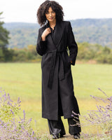 model wearing Cashmere Belted Shawl Collar Long Coat with Pick Stitching in black