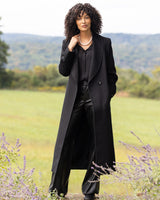 model wearing Cashmere Belted Shawl Collar Long Coat with Pick Stitching in black