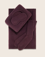 Aviano cashmere travel set in fig includes; eye mask, pillow, and socks