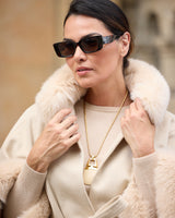 close up of model wearing Frostmere Belted Cashmere Cape in oat