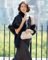 Woman on rooftop dressing in a formal dress and Fur Trimmed Cashmere Shawl in black