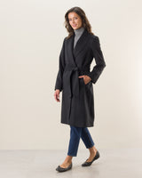 woman wearing black carmela cashmere wrap coat in black