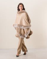 Woman wearing Fur Trimmed Cashmere cape in Blonde