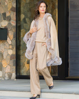 Woman wearing Fur Trimmed Cashmere cape in Blonde
