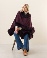 Woman Wearing Fur Trimmed cashmere Cape in plum
