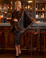 Model in a bar wearing Imperial Sable Cashmere Cape in black