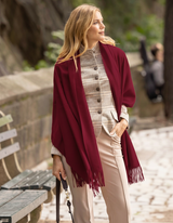 woman walking and wearing Elegante cashmere shawl wrap in Bordeaux
