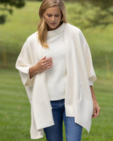 woman outside wearing Divina Double Knit Cashmere Cape in ivory