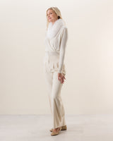 Woman wearing Wrap sweater with fur collar in Ivory