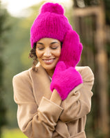 Woman wearing Mink Hat with Fox Fur Pom in Fuchsia