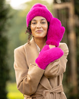 Woman wearing Mink Mittens in Fuchsia