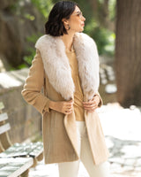 Woman wearing Alpaca Blend Wrap Short coat with Oversized Finland Fur Shawl Collar in Blonde outdoors