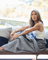 Reversible Jersey Knit cashmere Throw in Charcoal/Grey on model