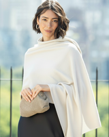 Woman wearing a Radiant Cashmere Sequin Wrap in ivory