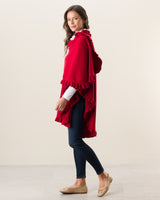 Side view of Woman Wearing Knitted Cashmere Cape in Red