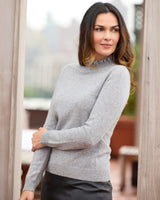 model wearing Aveline Ruffle Mock Neck Cashmere Sweater in grey