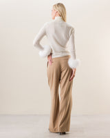 Woman wearing Cashmere Turtleneck with Finnish fur Cuffs in Ivory