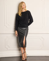 Model wearing a leather skirt and Stella Sequin Boat Neck Sweater in black