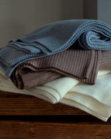 stack of cashmere Shaker knit throw in ivory