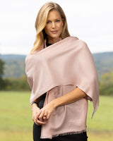 woman wearing Cashmere Lurex and Sequin Wrap in dusty rose wrapped across her chest
