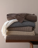 stack of Cable Knit Throws in Heather Taupe