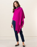 Woman wearing Voyage Cashmere Travel Wrap in Fuchsia