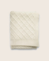 Folded cashmere blanket with diamond pattern in ivory