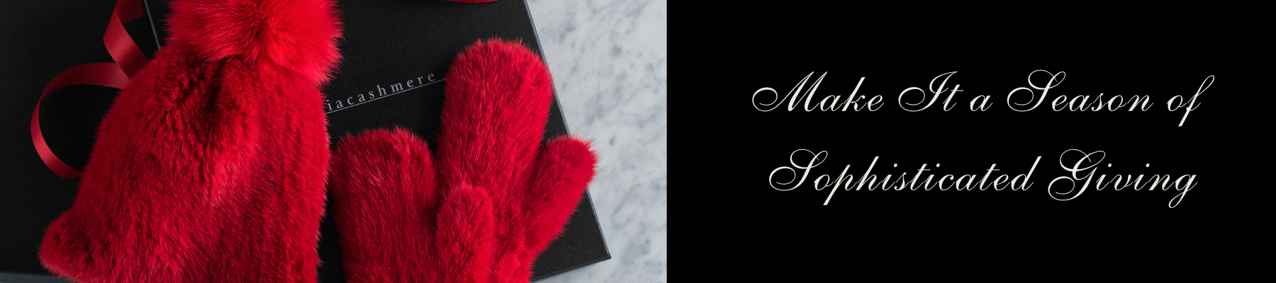 Red mittens and a black box with a bow on a textured surface, accompanied by text 'Make It a Season of Sophisticated Giving'.