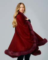 Woman wearing Fur Trimmed Cape in  Burgundy