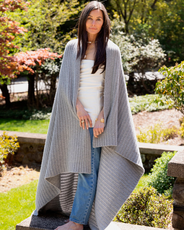 Woman with Biarritz Cashmere Throw around her shoulders  in Heather Grey
