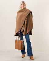 Woman Wearing Alpaca Wool Cape with Leather trim in Camel