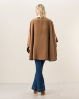 Woman Wearing Alpaca Wool Cape with Leather trim in Camel