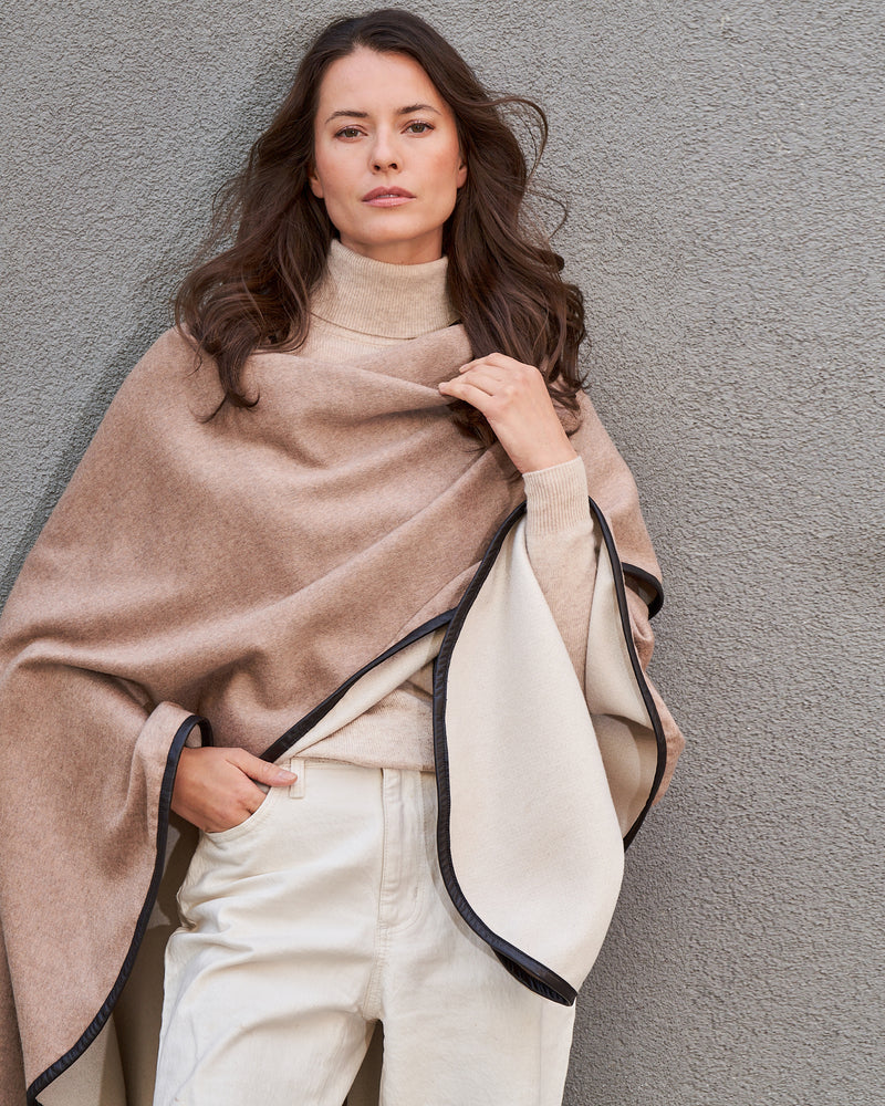 Model wearing Reversible Cashmere Cape with Leather trim in Oat/Beige
