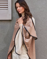 Model wearing Reversible Cashmere Cape with Leather trim in Oat/Beige