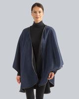 Woman Wearing Reversible Cashmere Cape with Leather trim in Blue/Black