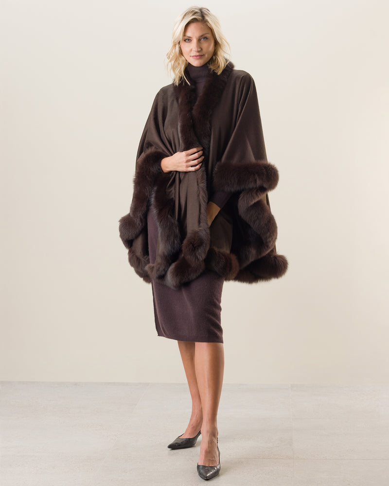 Woman Wearing Fur Trimmed Cape in Brown