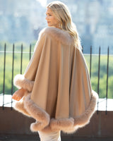 woman wearing Fur Trimmed Cashmere Cape in Camel 
