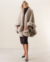 Woman wearing Fur Trimmed Cape in stone