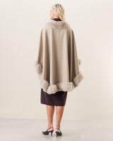 woman wearing Fur Trimmed Cape in stone