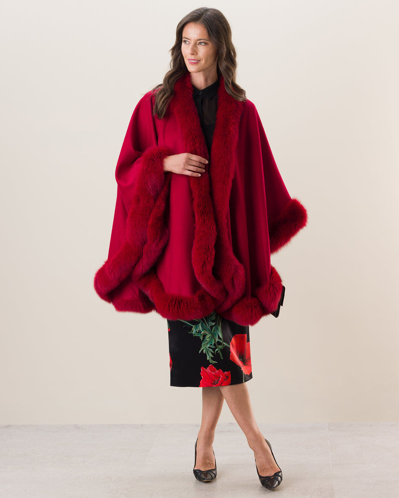 Woman wearing Fur Trimmed Cape in Red