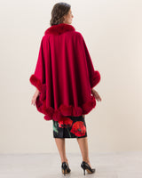 Woman wearing Fur Trimmed Cape in red