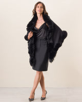 Woman Wearing Fur Trimmed Cashmere Shawl in Black