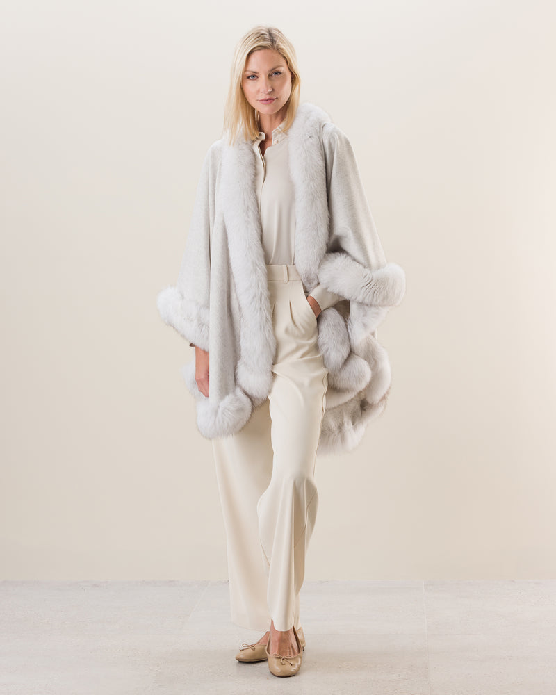 Woman wearing Fur Trimmed Cape in Glacier