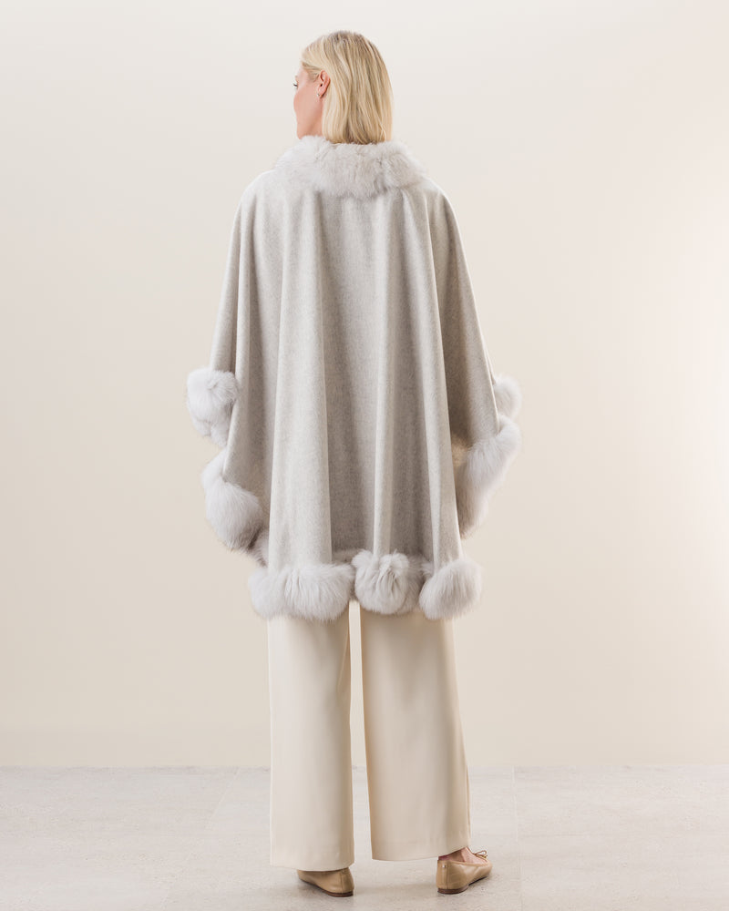 Woman Wearing Fur Trimmed Cape in Glacier