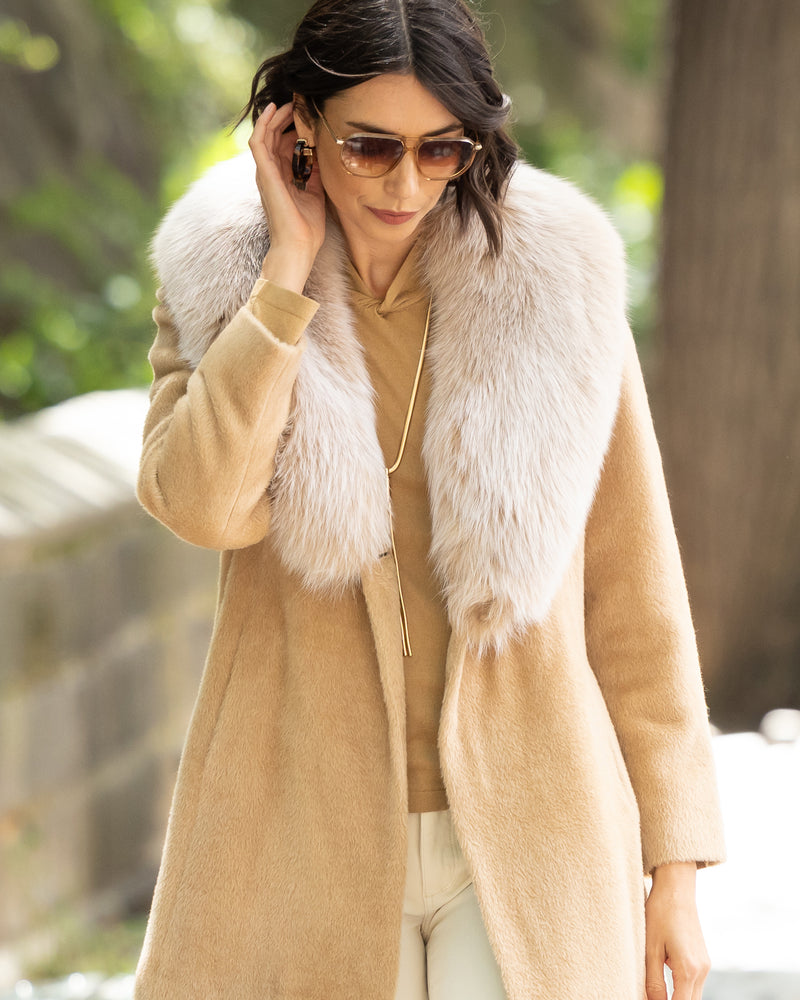 Woman wearing Alpaca Blend Wrap Short coat with Oversized Finland Fur Shawl Collar in BlondeWoman wearing Alpaca Blend Wrap Short coat with Oversized Finland Fur Shawl Collar in Blonde outdoors
