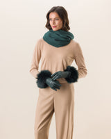 Woman wearing Mano fur trimmed leather glove in emerald